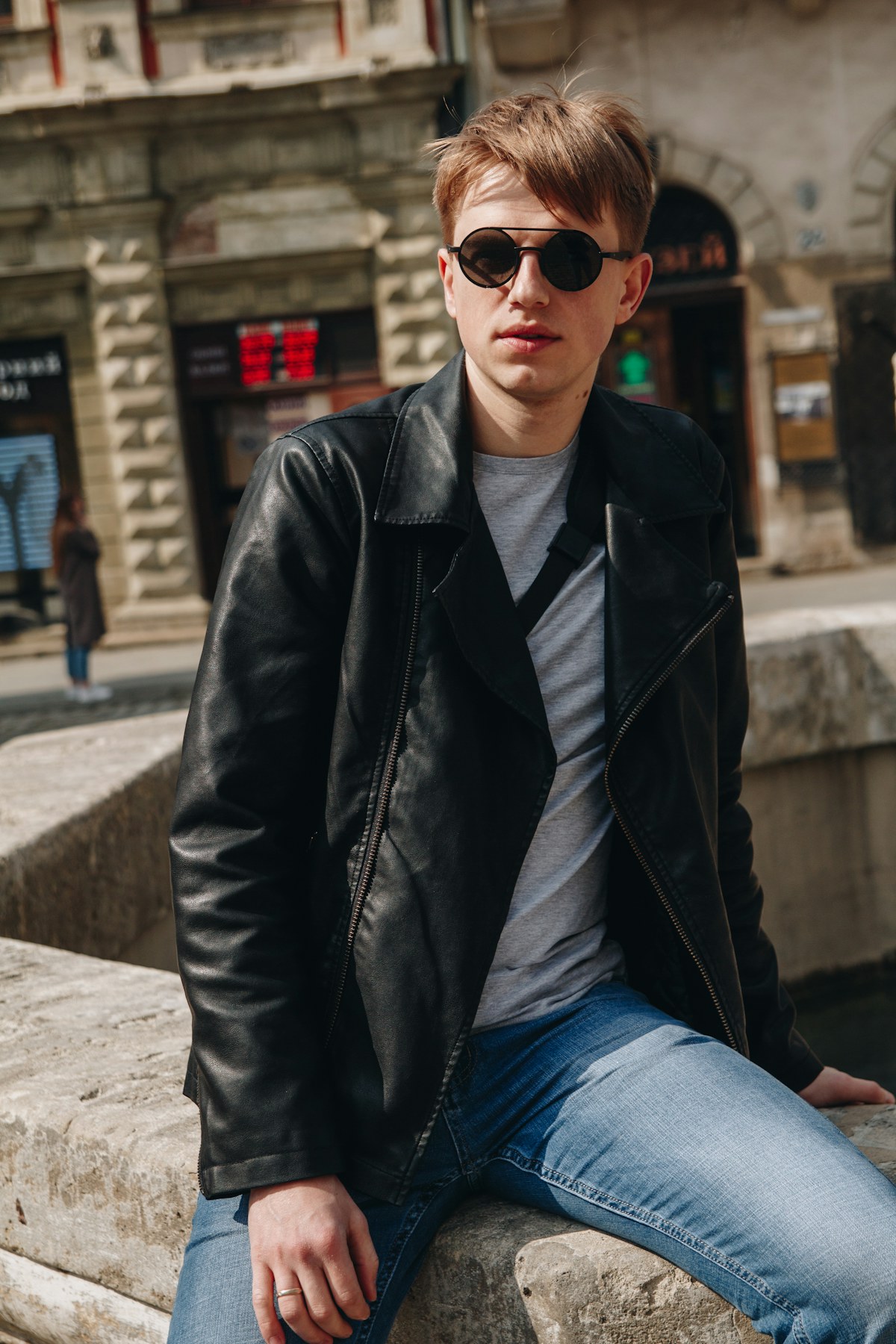 Man in a black leather jacket and sunglasses